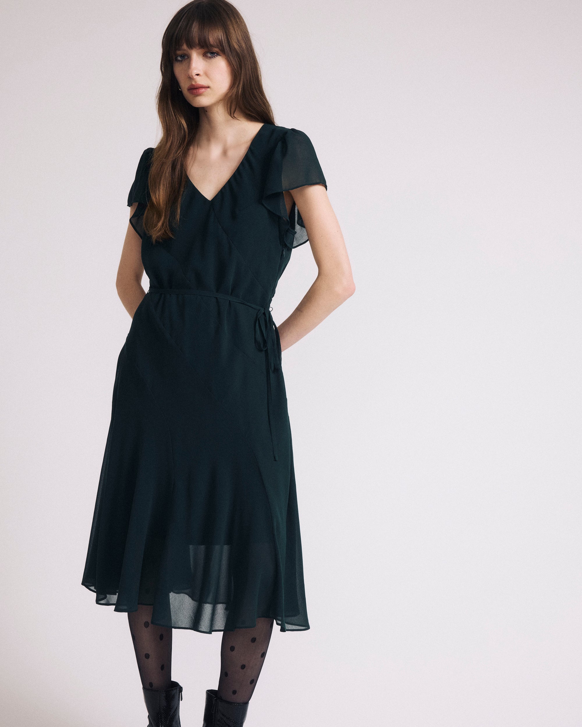 Woman wearing Seville Chiffon Dress - Forest Green from Universal Standard