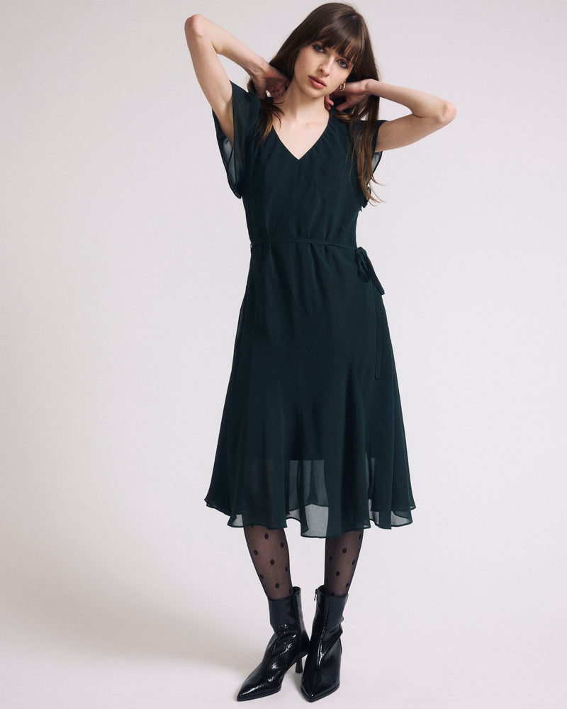 Woman wearing Seville Chiffon Dress - Forest Green from Universal Standard