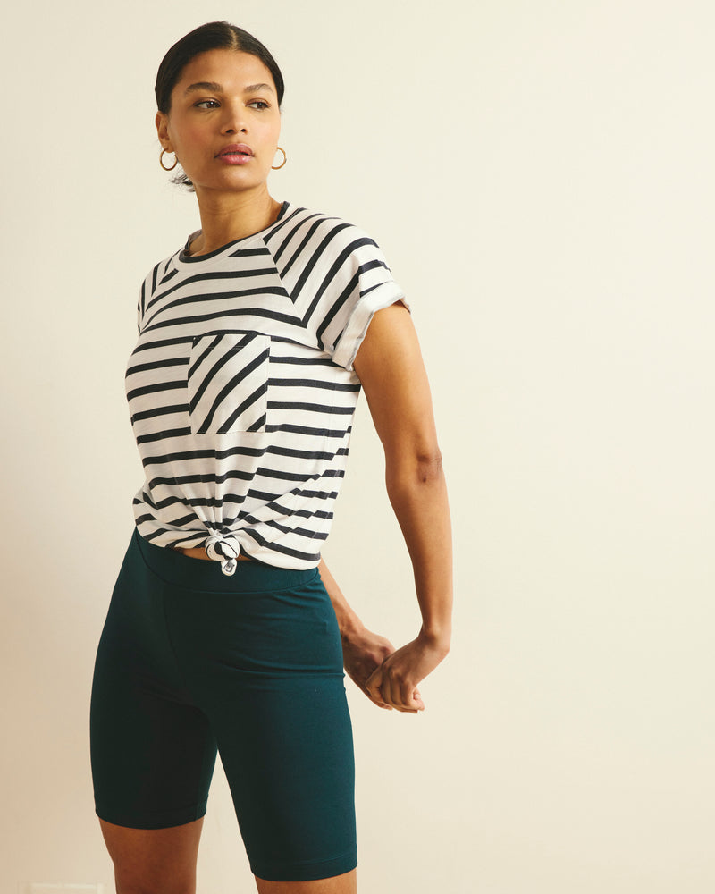 Woman wearing Roya Bike Shorts - Deep Sea from Universal Standard