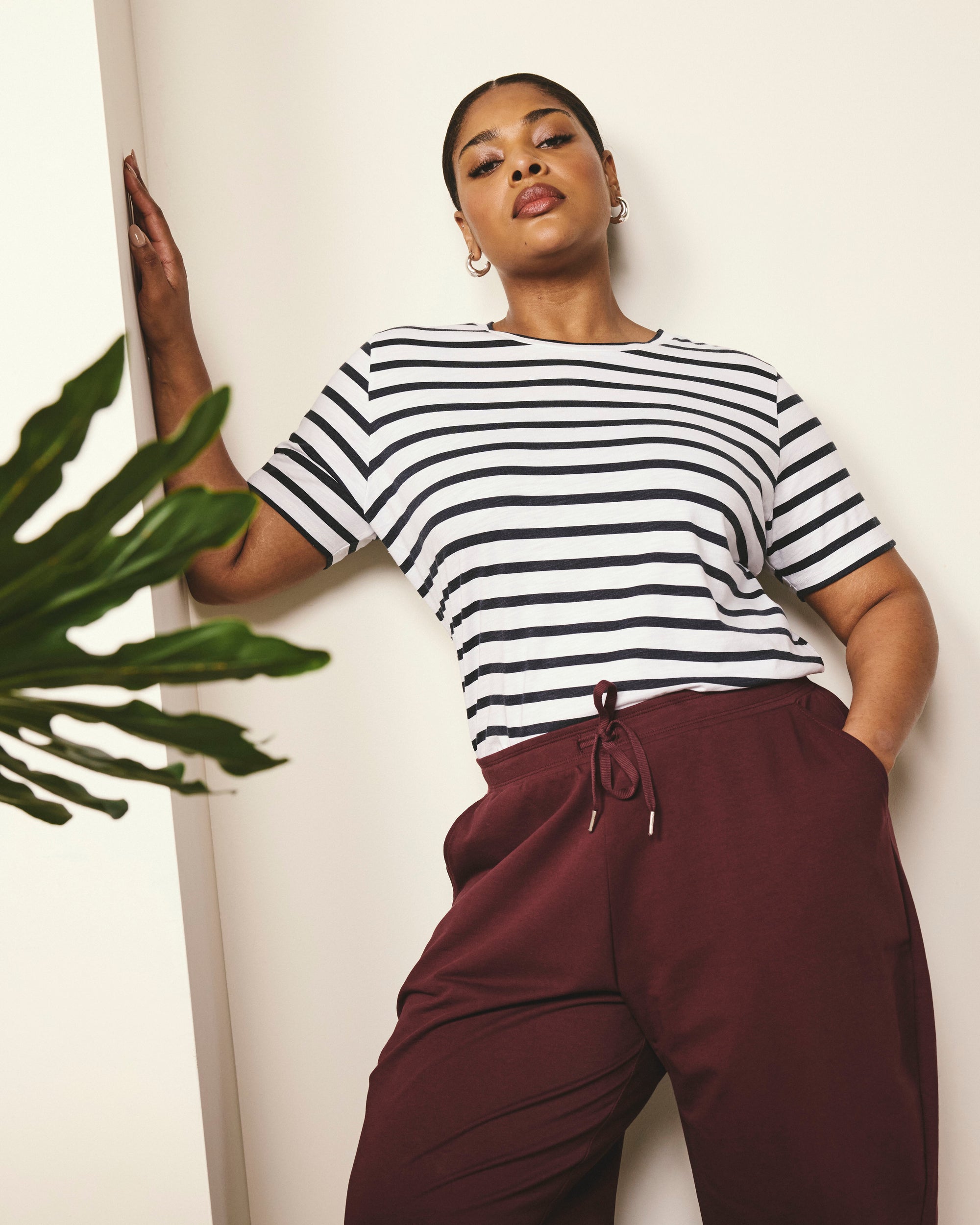 Woman wearing Selma French Terry Jogger - Black Cherry from Universal Standard