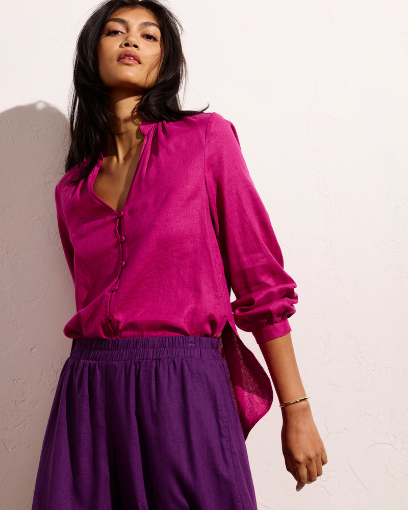 Woman wearing Avalon Linen Blouse - Hyper Pink from Universal Standard