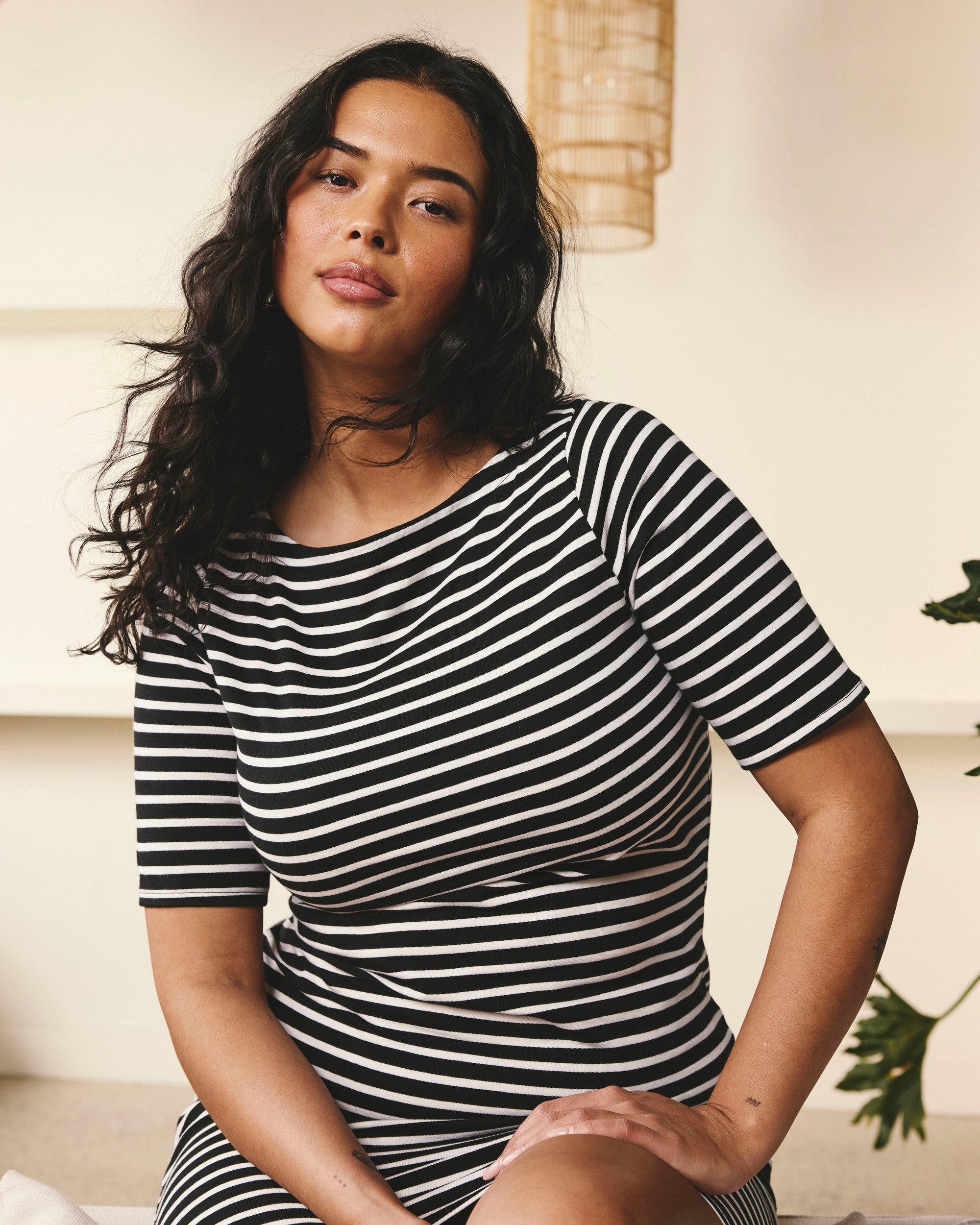 Woman wearing Belle Breton Stripe Jersey Dress - Black/White Stripe from Universal Standard