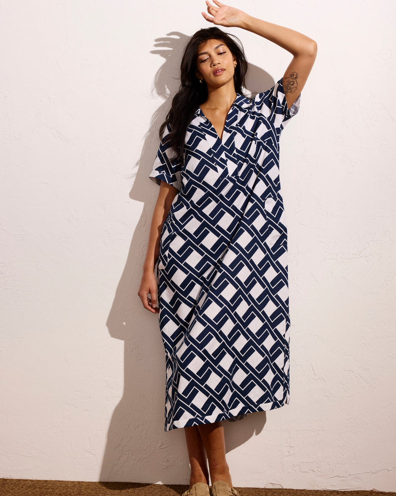 Woman wearing Padma Polo Neck Linen Dress - Geometrica Print from Universal Standard