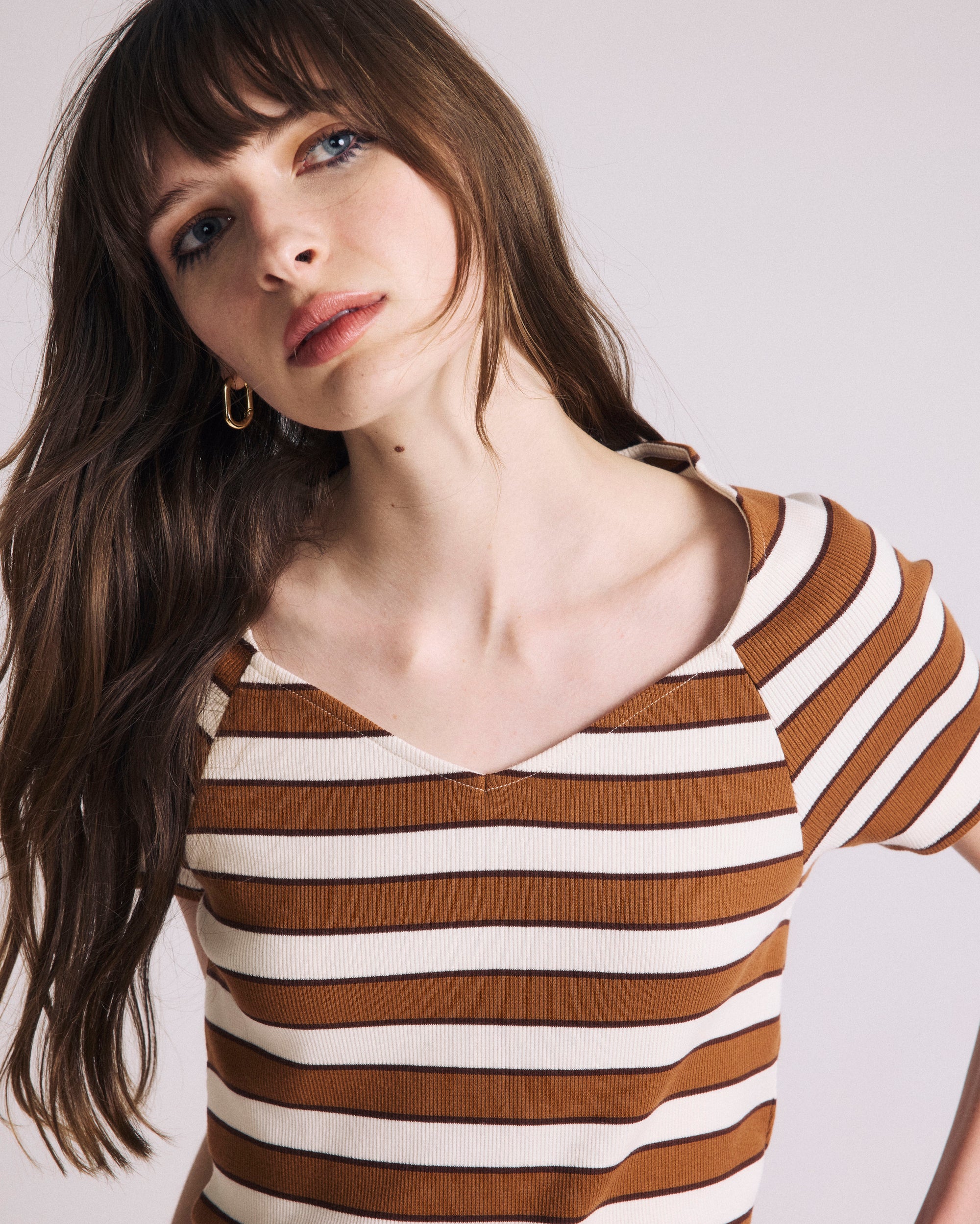Woman wearing Carey Ribbed Top - Baker Street Stripe from Universal Standard