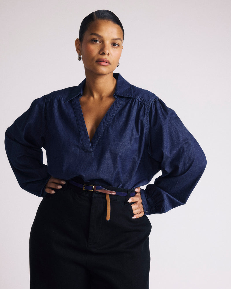 Woman wearing Maisie Cotton Chambray Blouse - Dark Indigo from Universal Standard