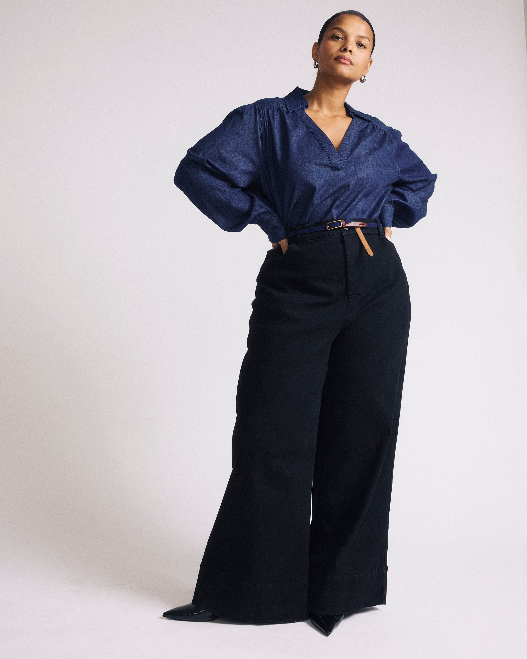 Woman wearing Maisie Cotton Chambray Blouse - Dark Indigo from Universal Standard