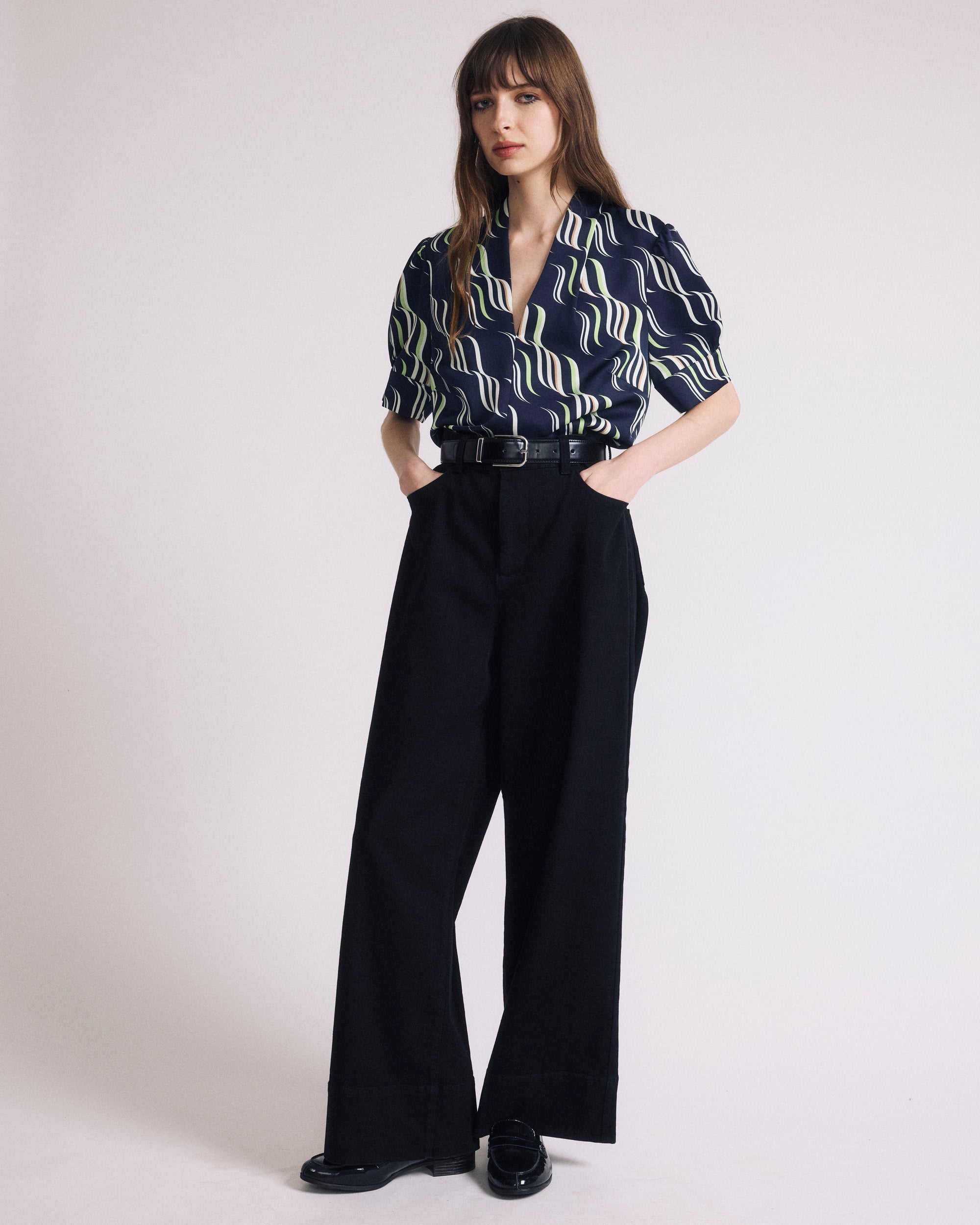 Woman wearing Beatrice Soft Satin Top - Paddington Ribbon Print from Universal Standard