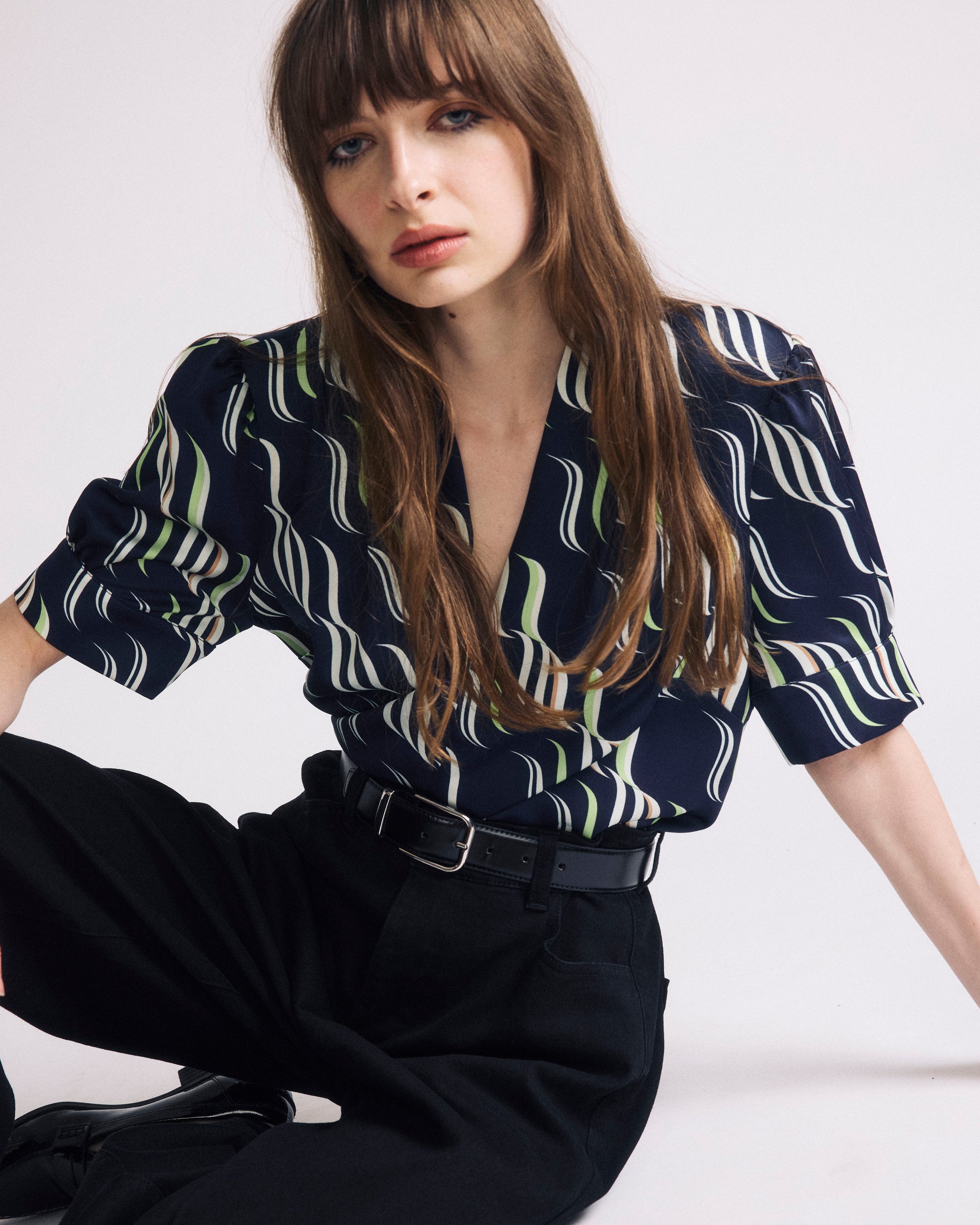 Woman wearing Beatrice Soft Satin Top - Paddington Ribbon Print from Universal Standard