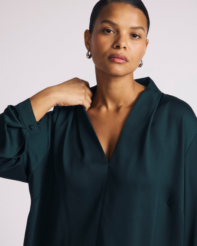 Woman wearing Georgette Satin Cambria Blouse - Forest Green from Universal Standard