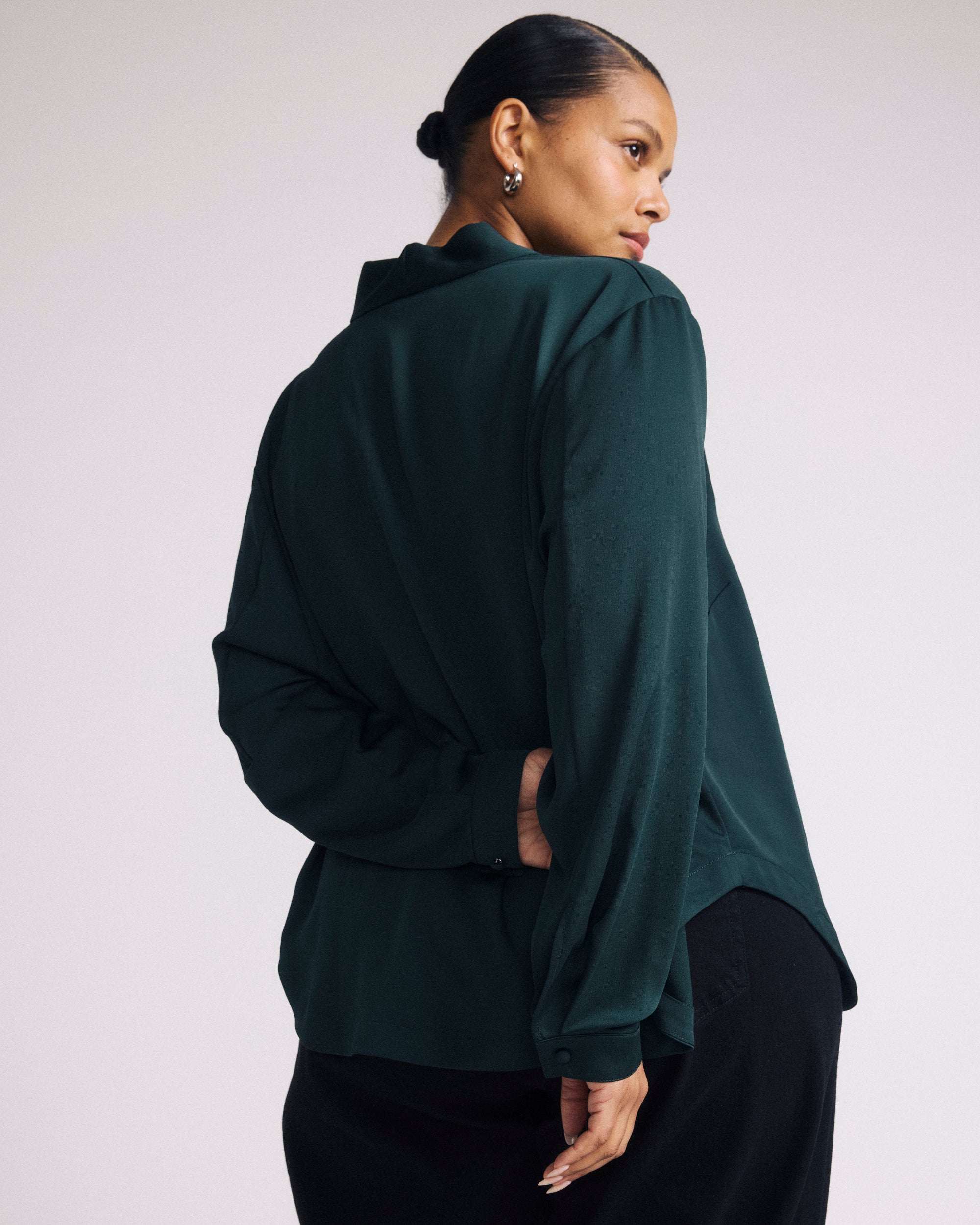 Woman wearing Georgette Satin Cambria Blouse - Forest Green from Universal Standard