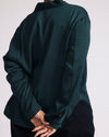 Woman wearing Georgette Satin Cambria Blouse - Forest Green from Universal Standard