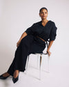Woman wearing Beatrice Soft Satin Top - Black from Universal Standard