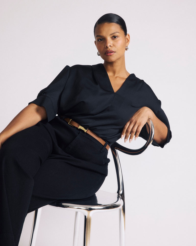 Woman wearing Beatrice Soft Satin Top - Black from Universal Standard