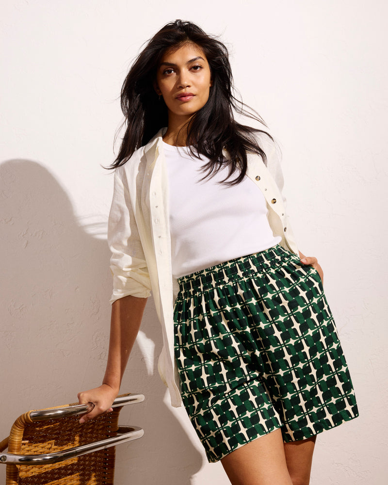 Woman wearing Juniper Linen Easy Pull-On Shorts - Green Trellis Print from Universal Standard