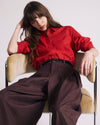 Woman wearing Elbe Popover Stretch Linen Shirt - Brilliant Red from Universal Standard