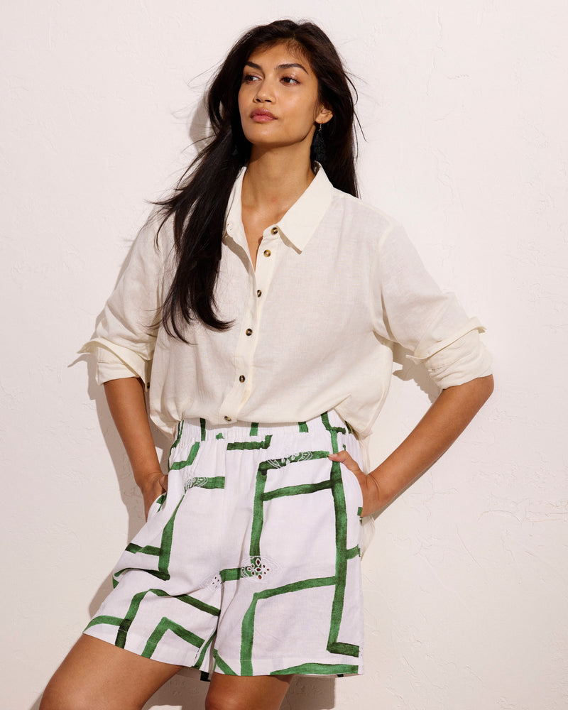 Woman wearing Juniper Linen Easy Pull-On Shorts - Green Paint Print from Universal Standard