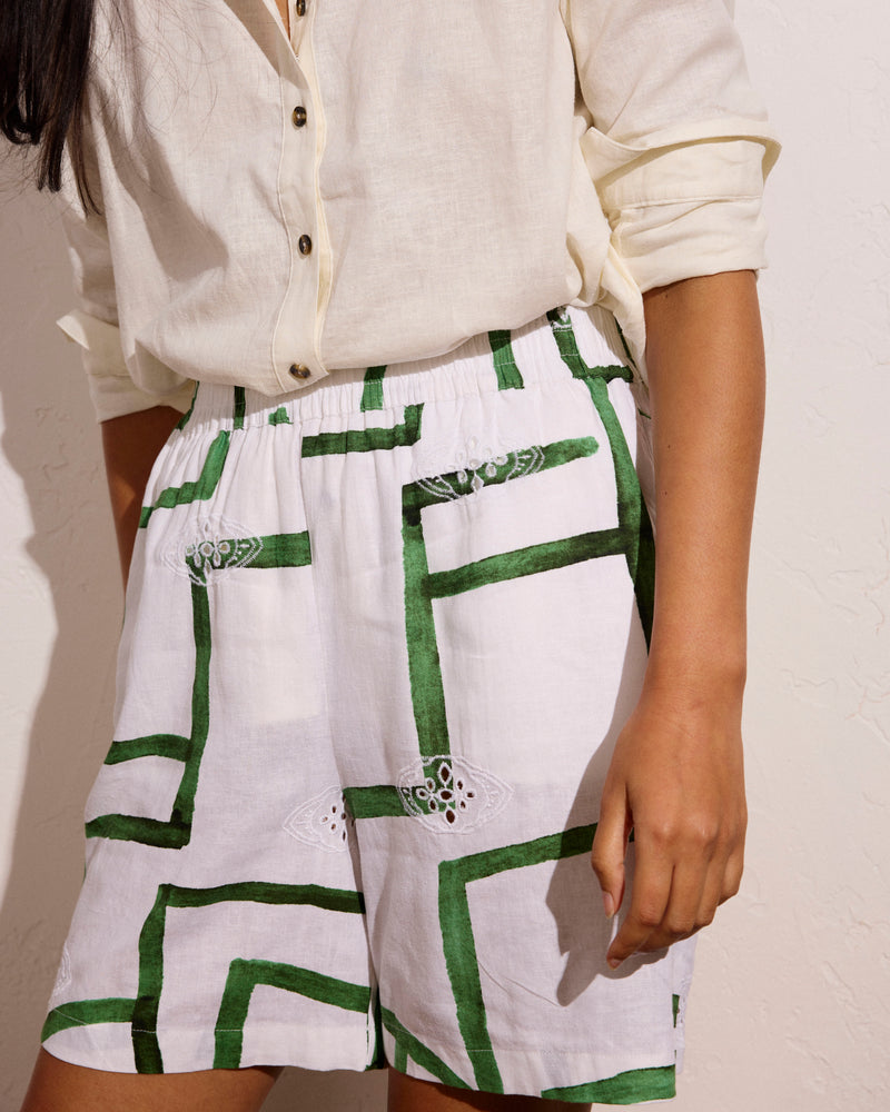 Woman wearing Juniper Linen Easy Pull-On Shorts - Green Paint Print from Universal Standard
