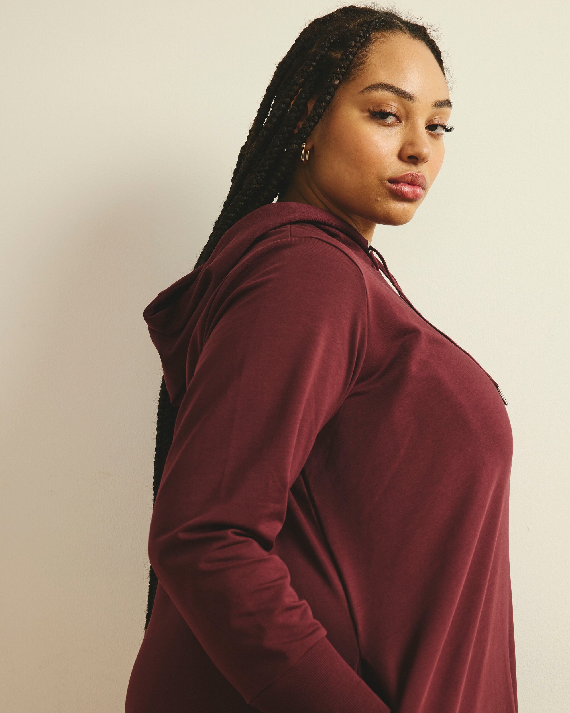 Woman wearing Bree Hooded Sweatshirt Dress - Black Cherry from Universal Standard