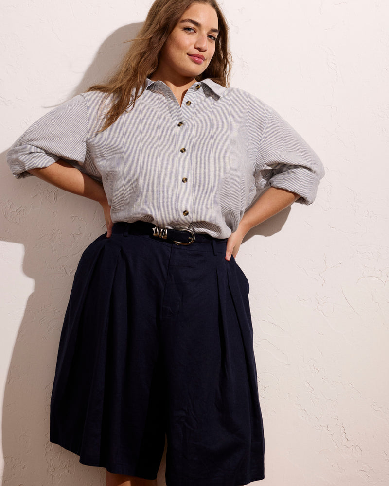 Woman wearing Seaport Tailored Linen Short - Navy from Universal Standard