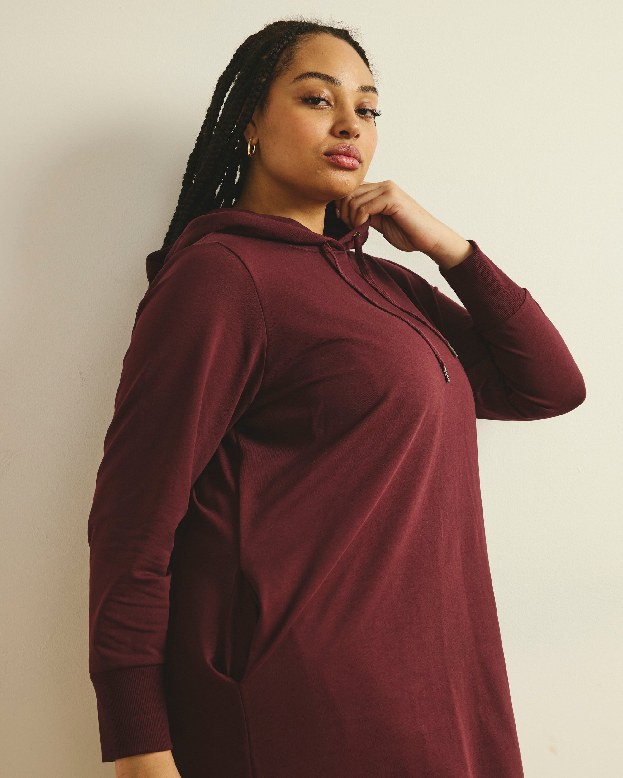 Woman wearing Bree Hooded Sweatshirt Dress - Black Cherry from Universal Standard