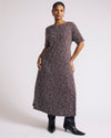 Woman wearing Serena Boat Neck Divine Jersey Dress - Brown/White Dot Print from Universal Standard