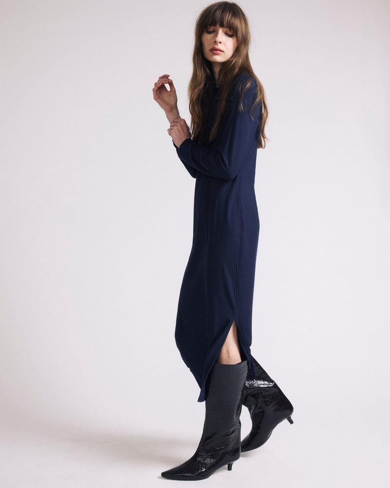 Woman wearing Xenia Ribbed Dress - Midnight from Universal Standard