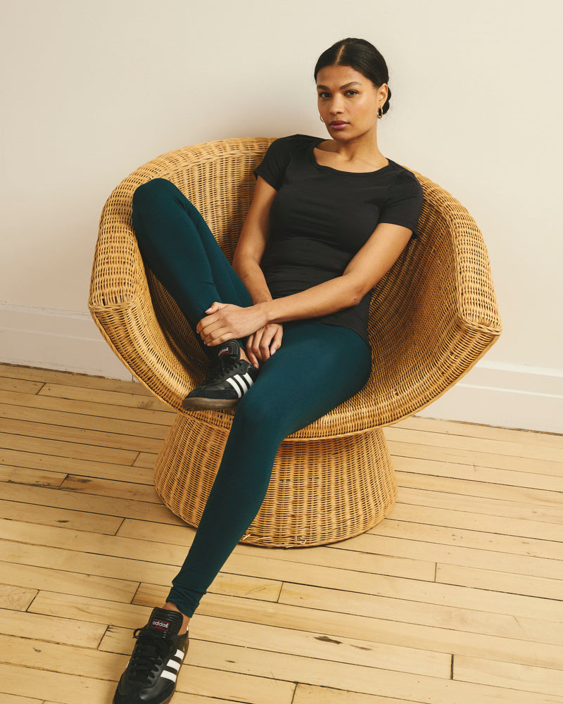 Woman wearing Roya Leggings 27 Inch - Deep Sea from Universal Standard