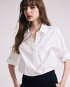 Woman wearing Button Back Poplin Polo Shirt - White from Universal Standard