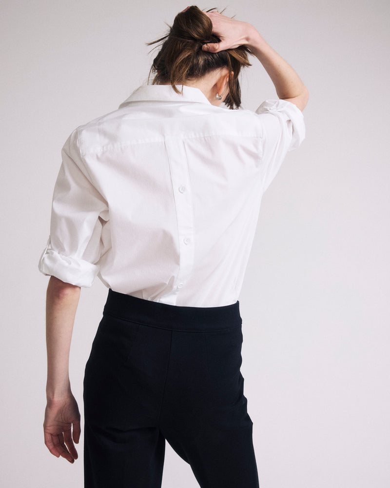 Woman wearing Button Back Poplin Polo Shirt - White from Universal Standard