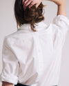 Woman wearing Button Back Poplin Polo Shirt - White from Universal Standard