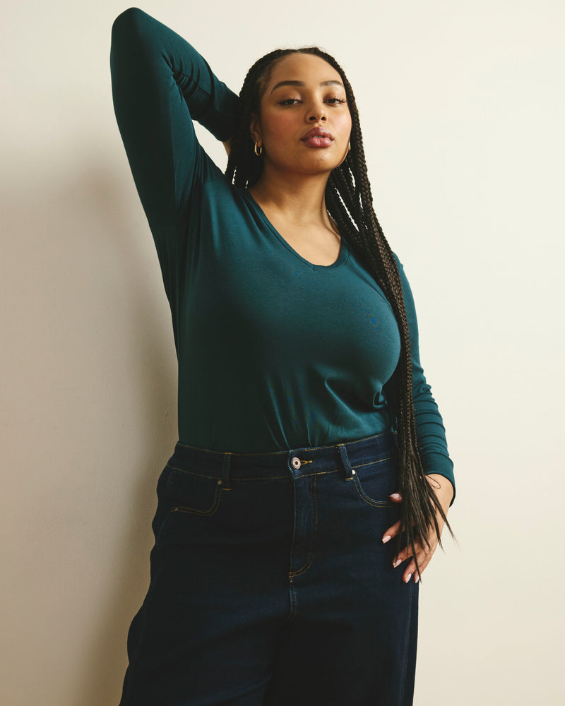 Woman wearing Long Sleeve V Rex - Deep Sea from Universal Standard