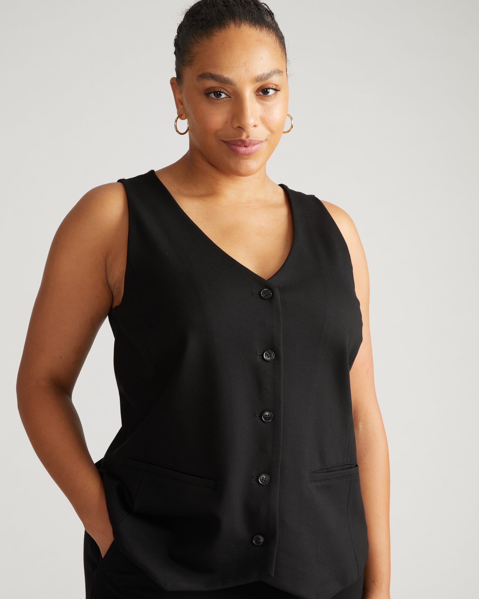 Woman wearing The Tailored Ponte Vest - Black from Universal Standard