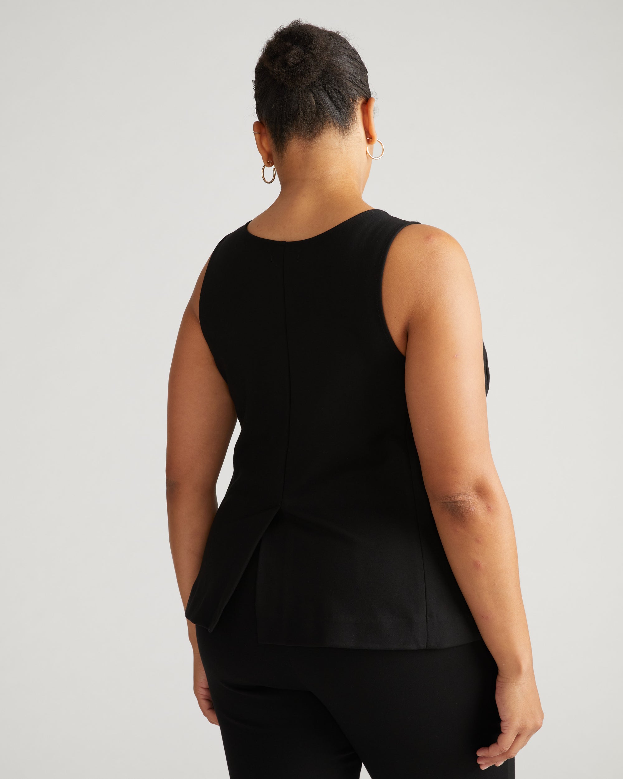 Woman wearing The Tailored Ponte Vest - Black from Universal Standard