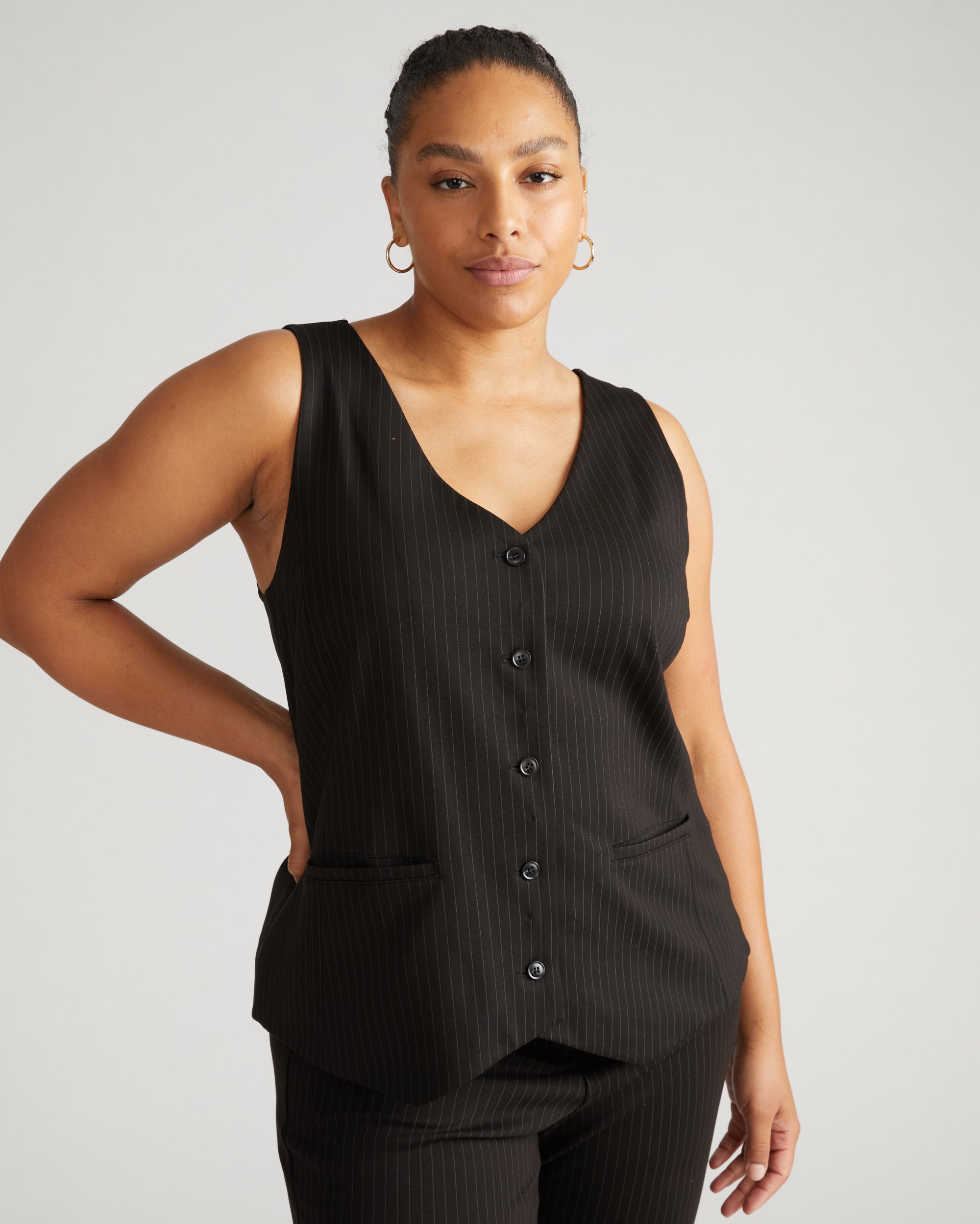 Woman wearing The Tailored Ponte Vest - Slate Pinstripe from Universal Standard