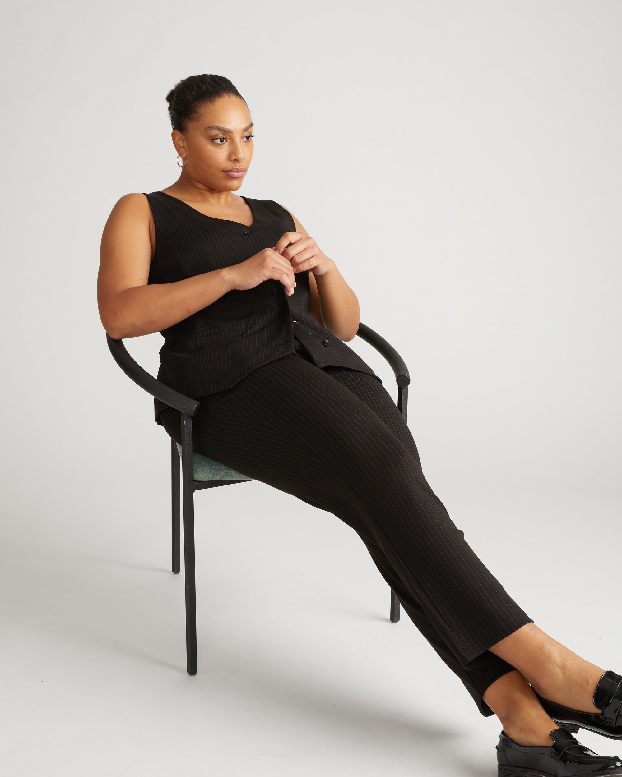 Woman wearing The Tailored Ponte Vest - Slate Pinstripe from Universal Standard