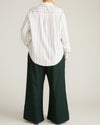 Woman wearing Elbe Popover Stretch Linen Shirt - Mayfair Stripe from Universal Standard