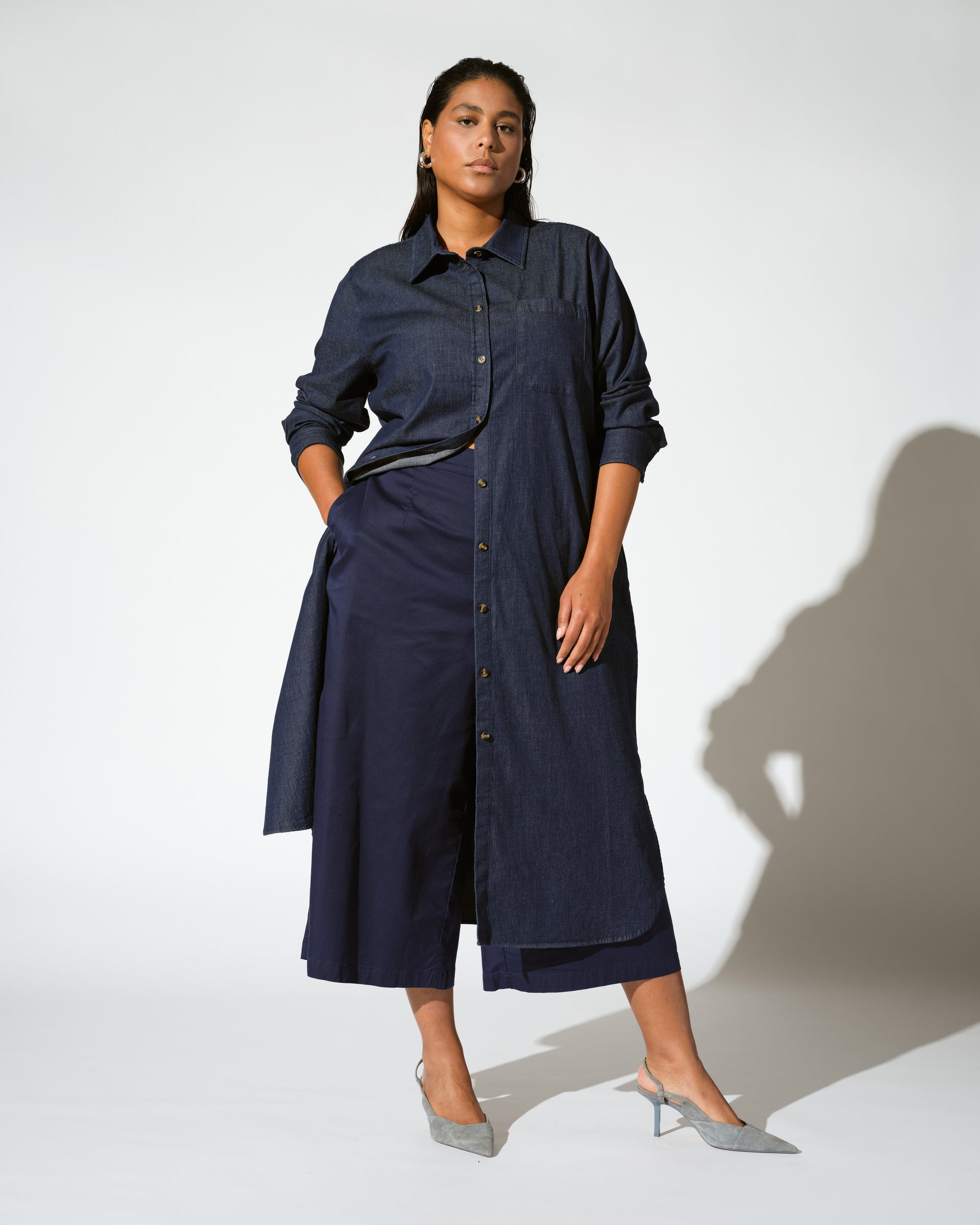 Woman wearing Odeon Stretch Cotton Chambray Shirtdress - Dark Indigo from Universal Standard