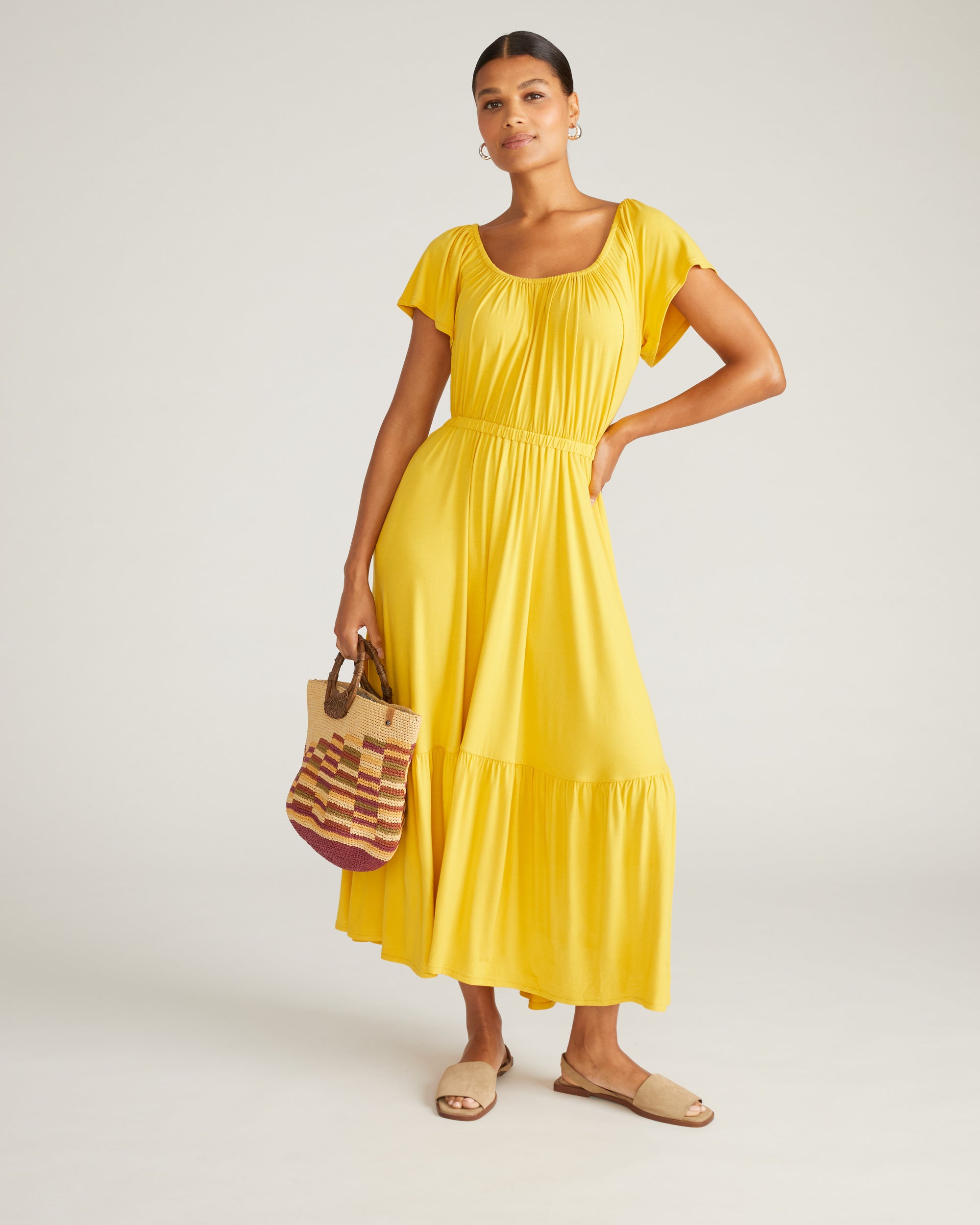 yellow jersey maxi dress SELF-PORTRAIT BANGKOK | Striking and sculptural, this yellow jersey maxi dress skims the figure with its twist-front bodice and gathered waist. A backless cut adds