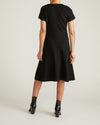 Woman wearing Lucinda Ponte Dress - Black from Universal Standard