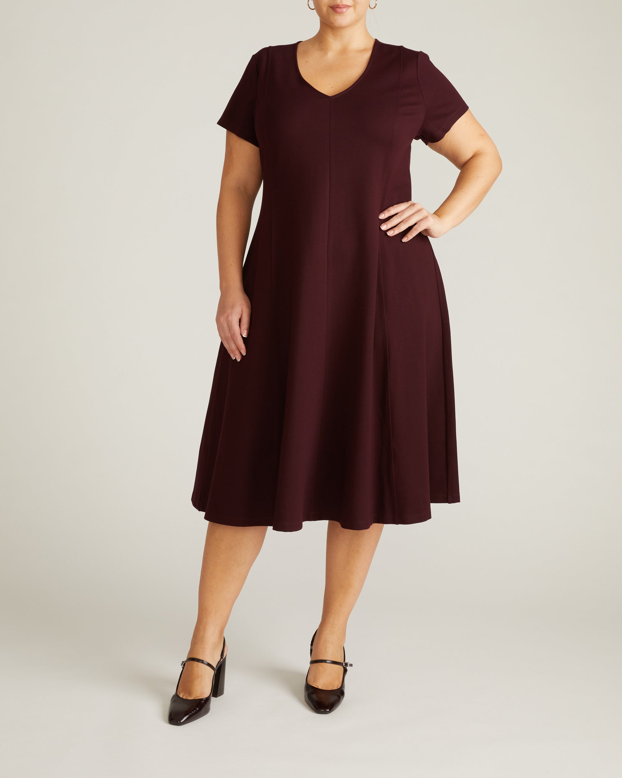 Woman wearing Lucinda Ponte Dress - Black Cherry from Universal Standard