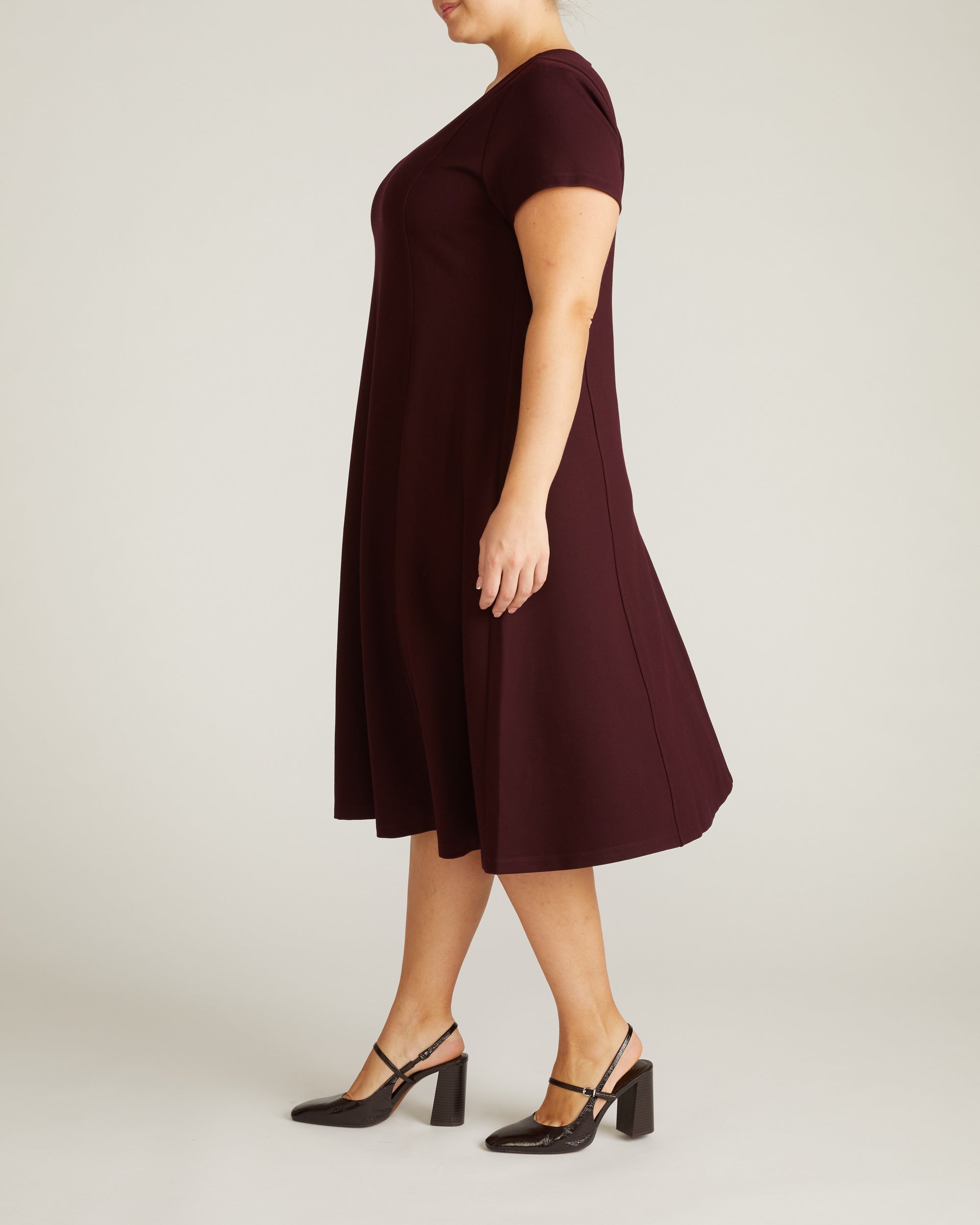 Woman wearing Lucinda Ponte Dress - Black Cherry from Universal Standard