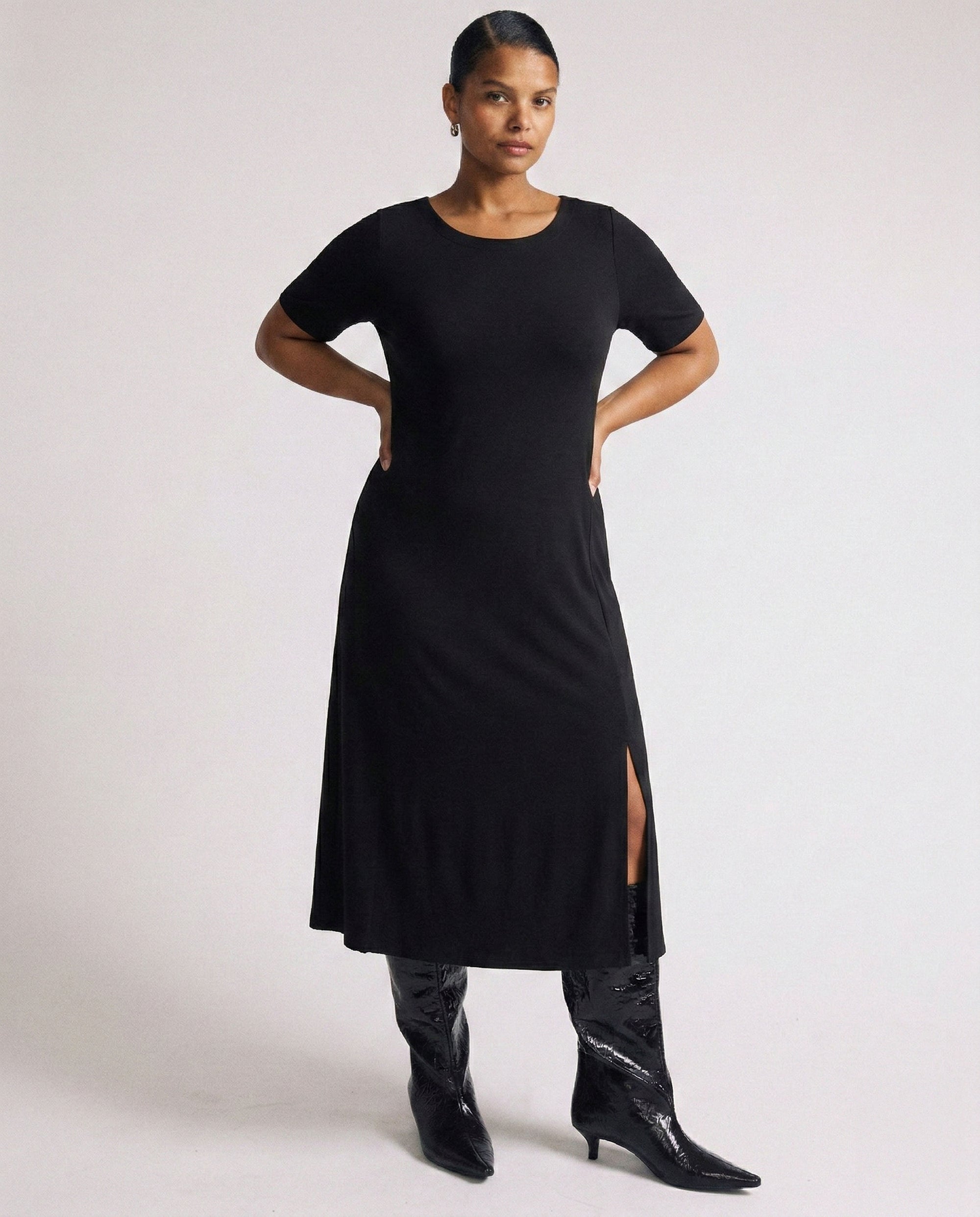 Woman wearing Serena Boat Neck Divine Jersey Dress - Black from Universal Standard