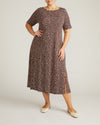 Woman wearing Serena Boat Neck Divine Jersey Dress - Brown/White Dot Print from Universal Standard