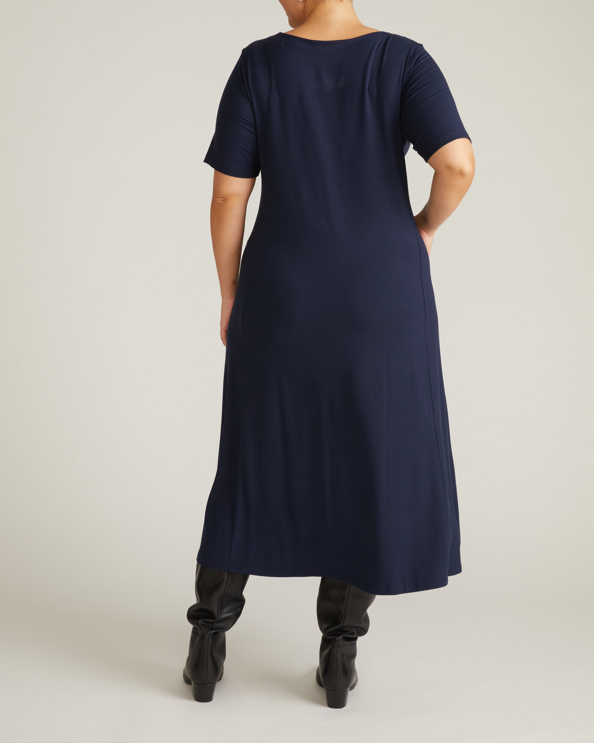 Woman wearing Serena Boatneck Divine Jersey Dress - Midnight from Universal Standard