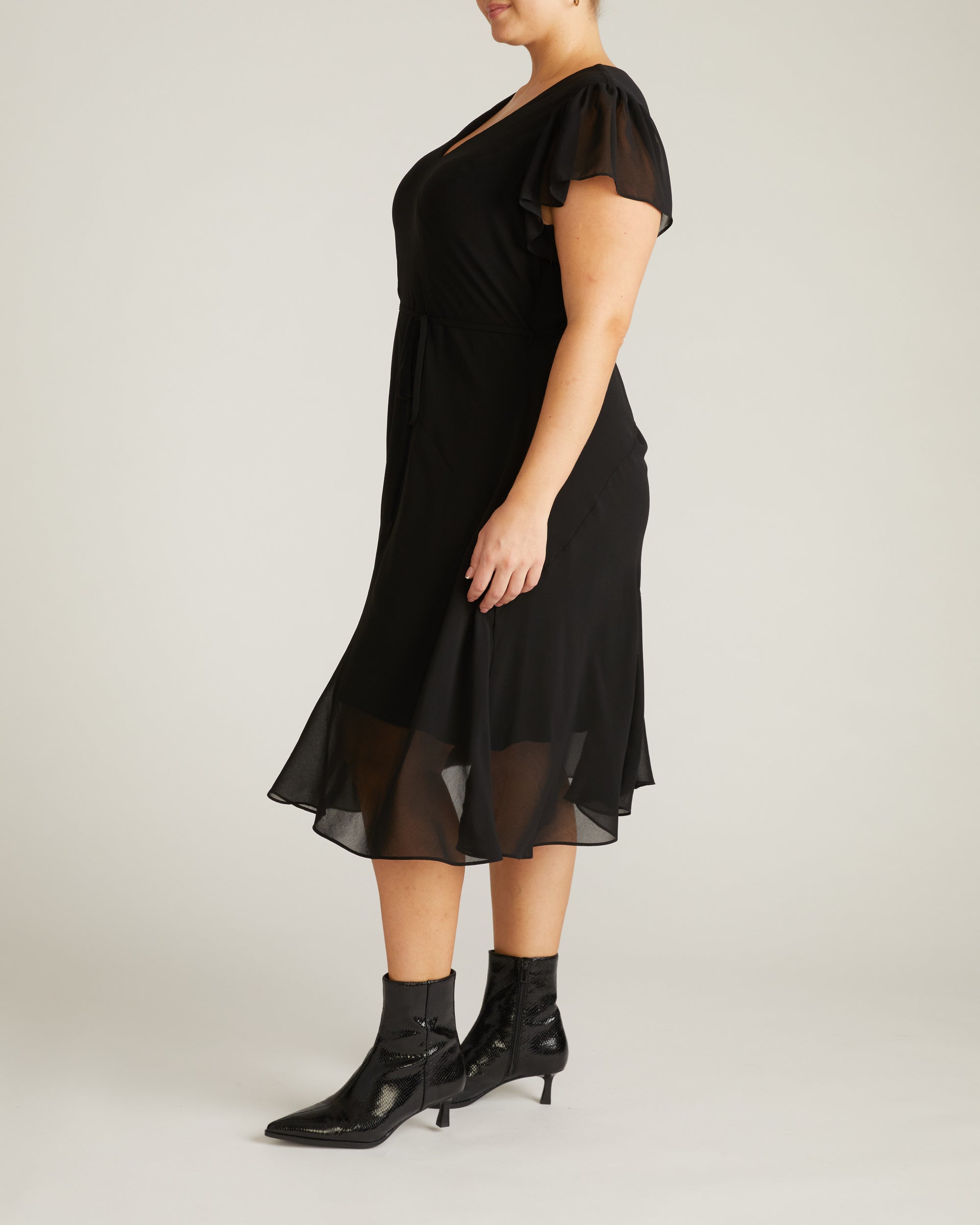 Woman wearing Seville Chiffon Dress - Black from Universal Standard
