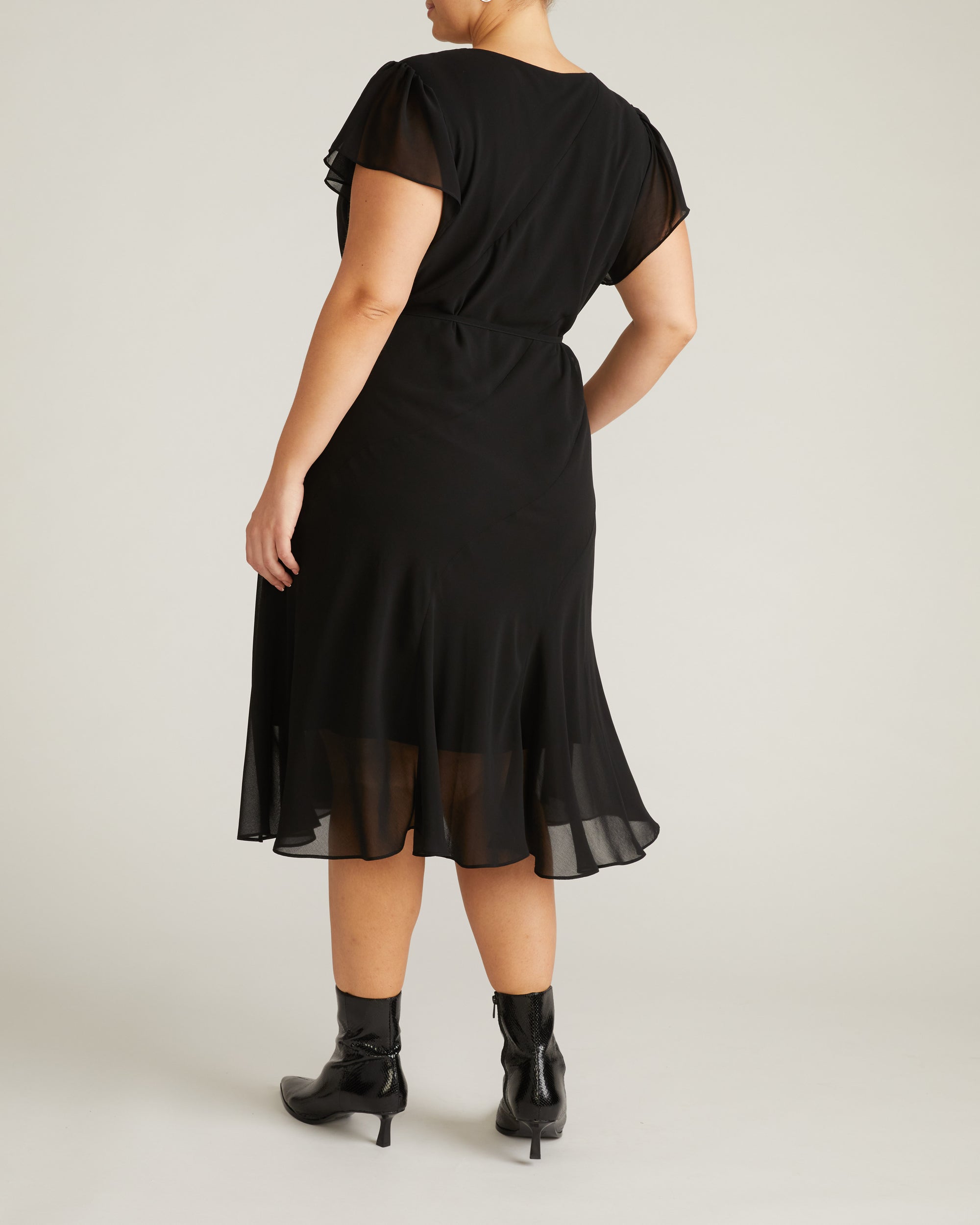 Woman wearing Seville Chiffon Dress - Black from Universal Standard