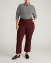 Woman wearing Amaya Ponte Kick Flare Pants - Black Cherry from Universal Standard