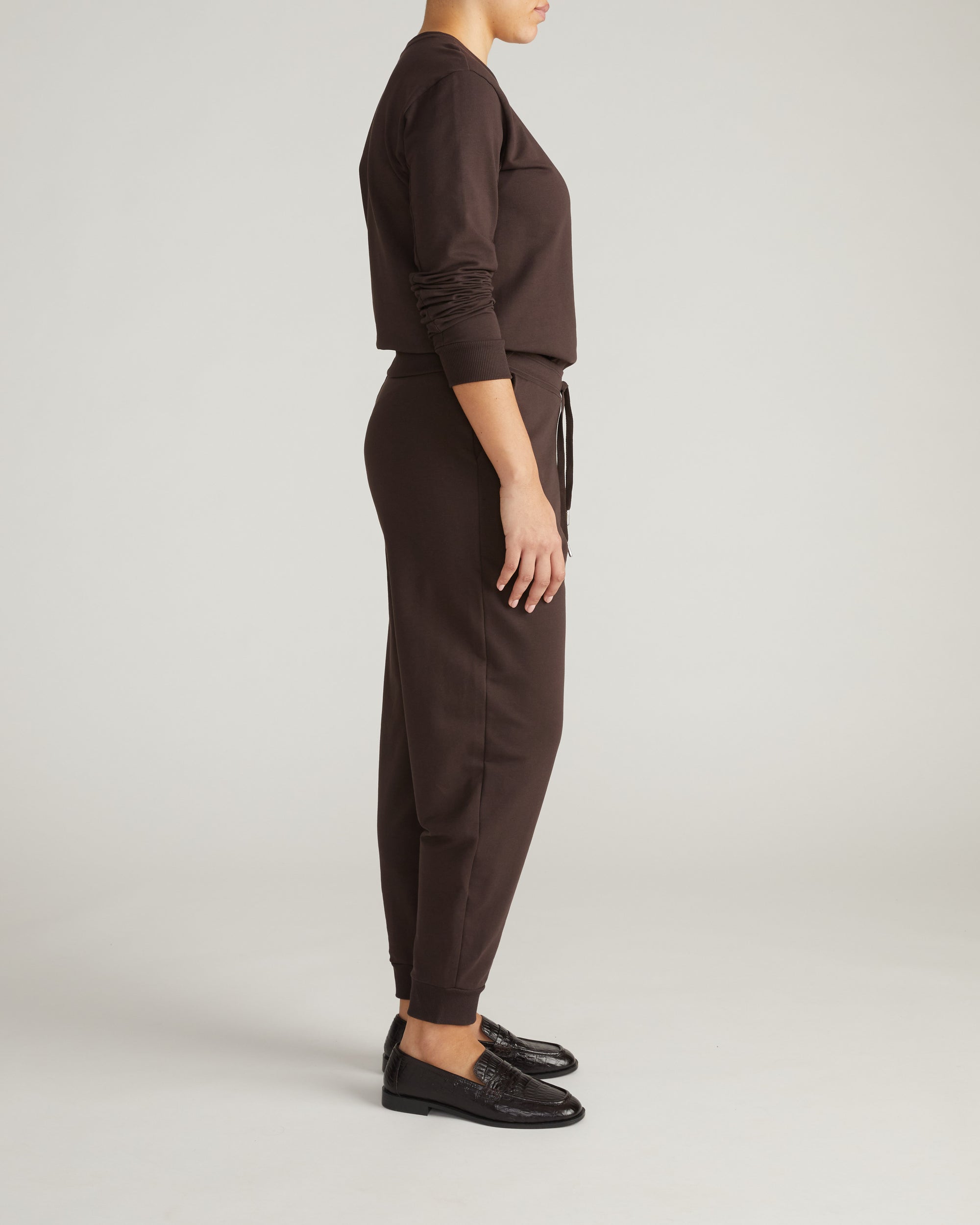 Woman wearing Selma French Terry Jogger - Deep Brown from Universal Standard