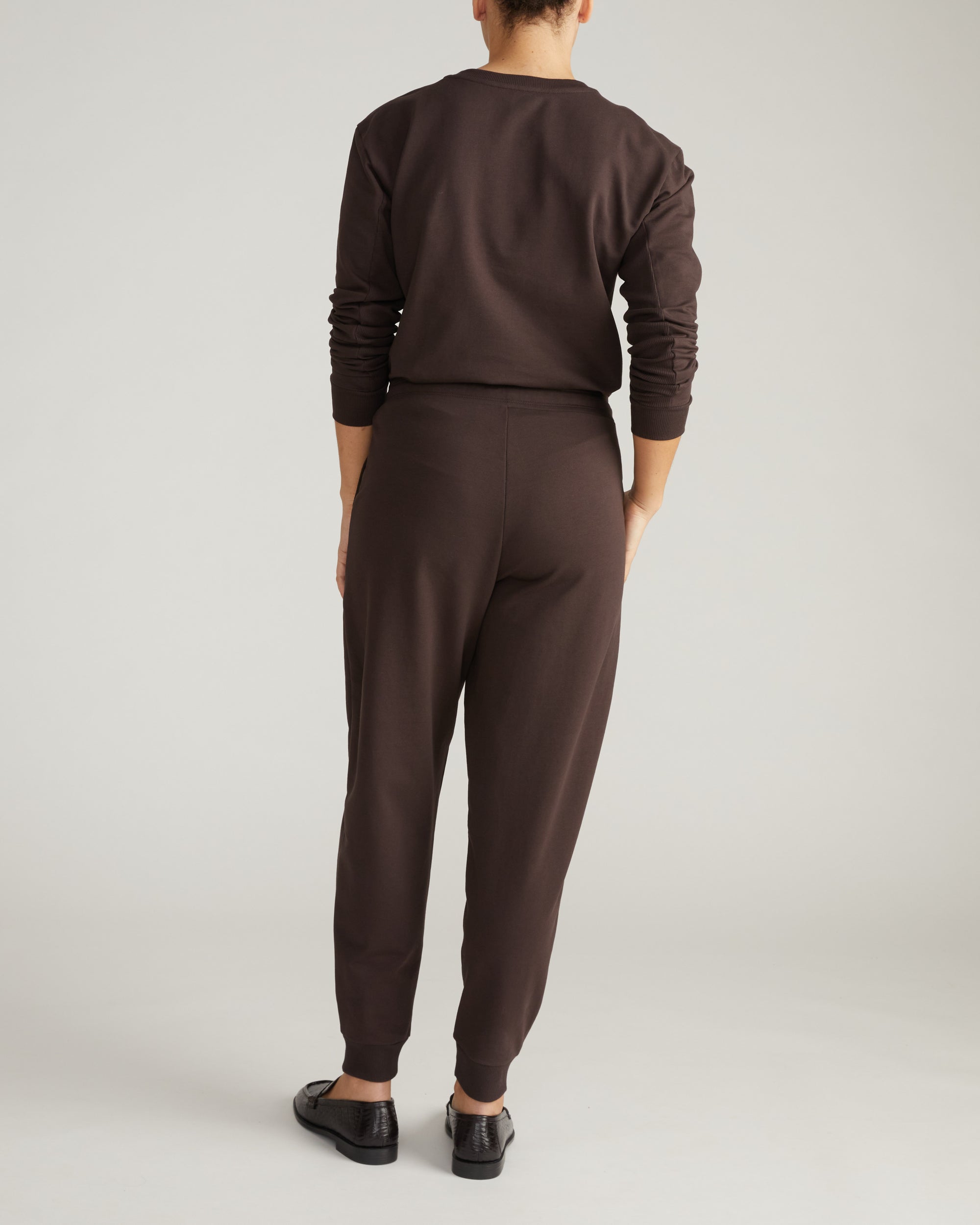 Woman wearing Selma French Terry Jogger - Deep Brown from Universal Standard