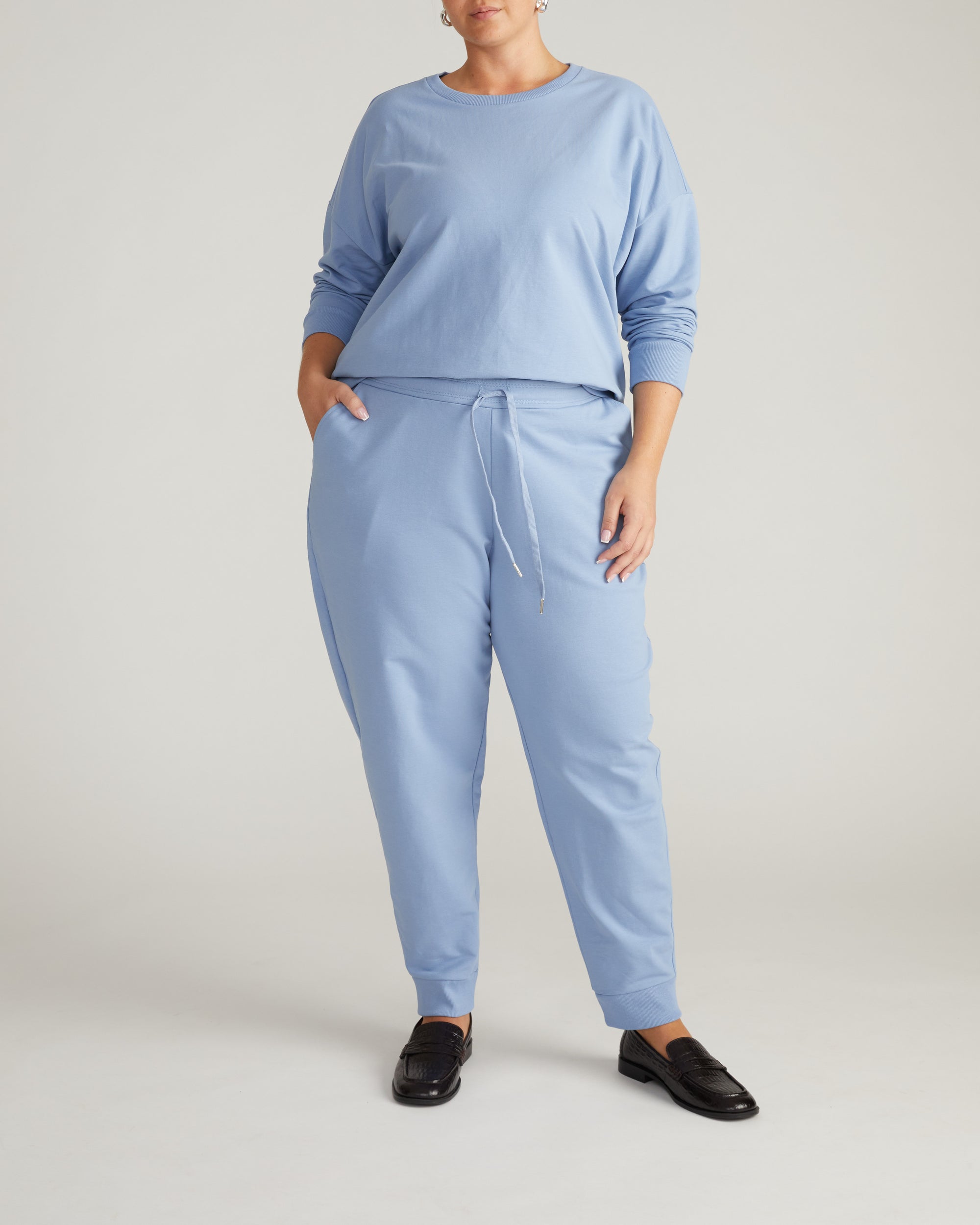 Woman wearing Selma French Terry Jogger - Graceful Blue from Universal Standard